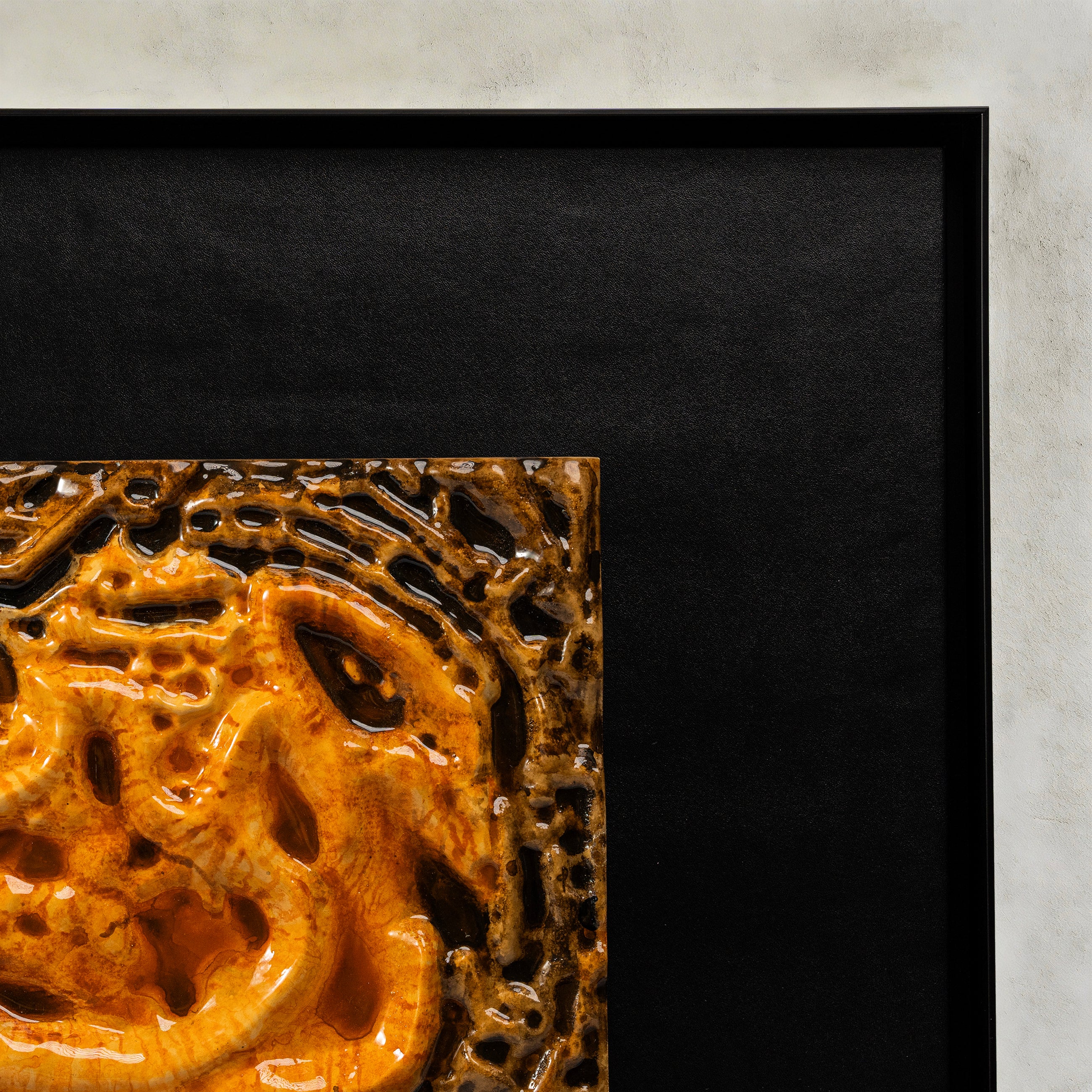 Corner detail of Coiled Dragon — Aquarelle · Aura Frame, showing the hand-dyed color migration across the earth element mineral terrain — light hazel at the uppermost ridgelines fusing through graduated browns into deep umber in the valleys below.