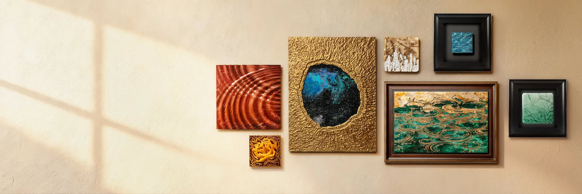 A sunlit gallery wall displaying a collection of textured and framed abstract artworks.