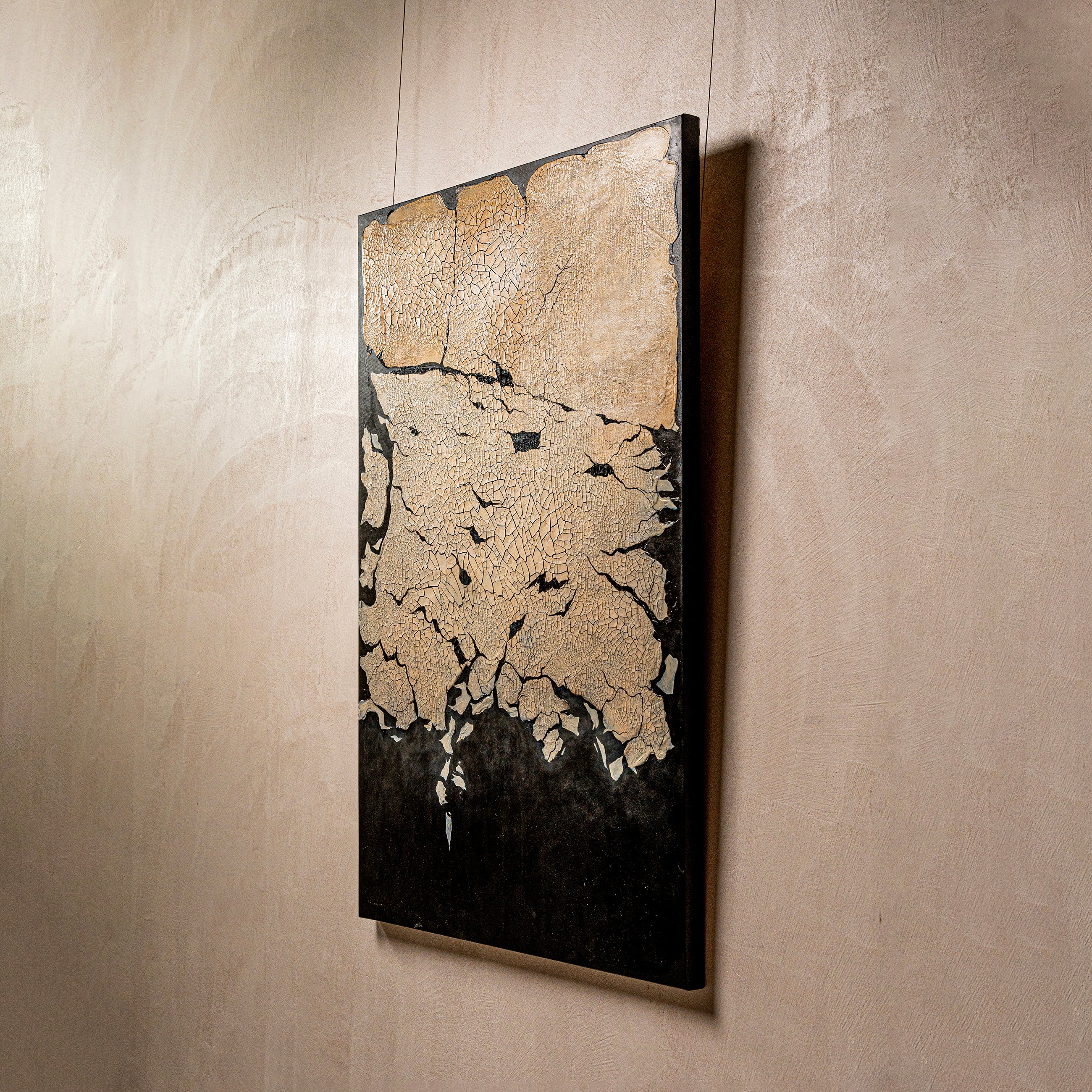 Gold from the Rift — macro surface detail capturing the luminous interplay of light across the textured earth element finish, evoking the quiet radiance of gold emerging from fractured ground.