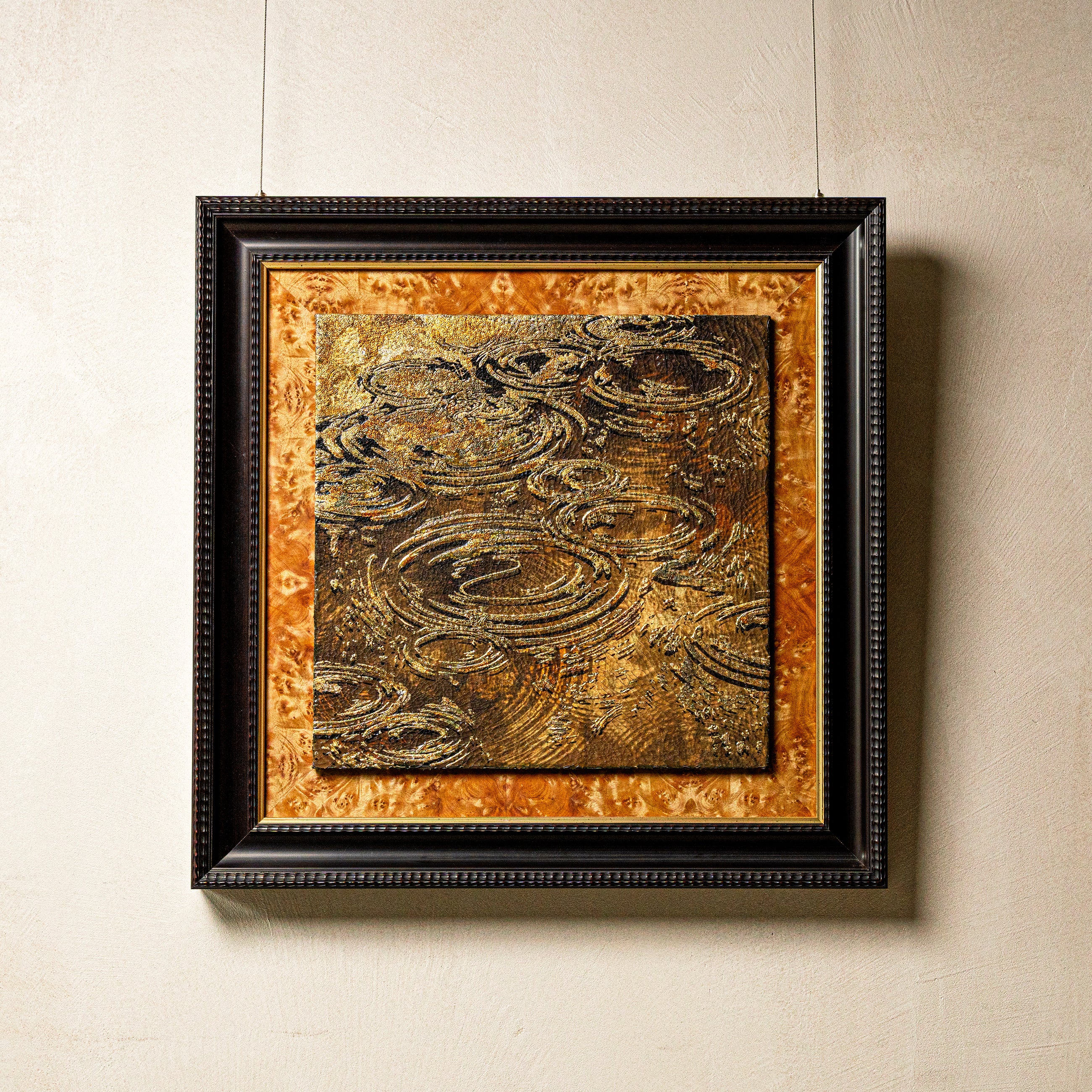 Harvest Tide — Patinated Foil, full view of a handcrafted wall art where water element-inspired concentric wave ripples spiral upward across a richly textured mineral surface of natural crackle ground and ICH-certified fired foil.