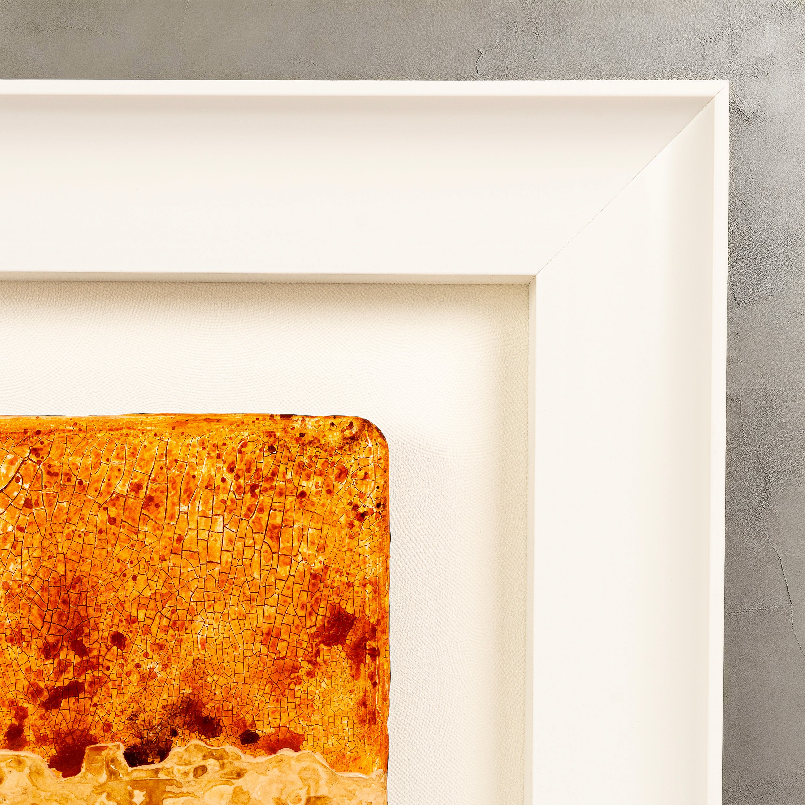 Corner detail of Igneous — Mineral Texture · Aura Frame, showing the ICH hand-painted crackle fissures formed as mineral pigment cures at different rates — dense and stratified in some passages, wider in others — reading as fire element rock in cross-section.