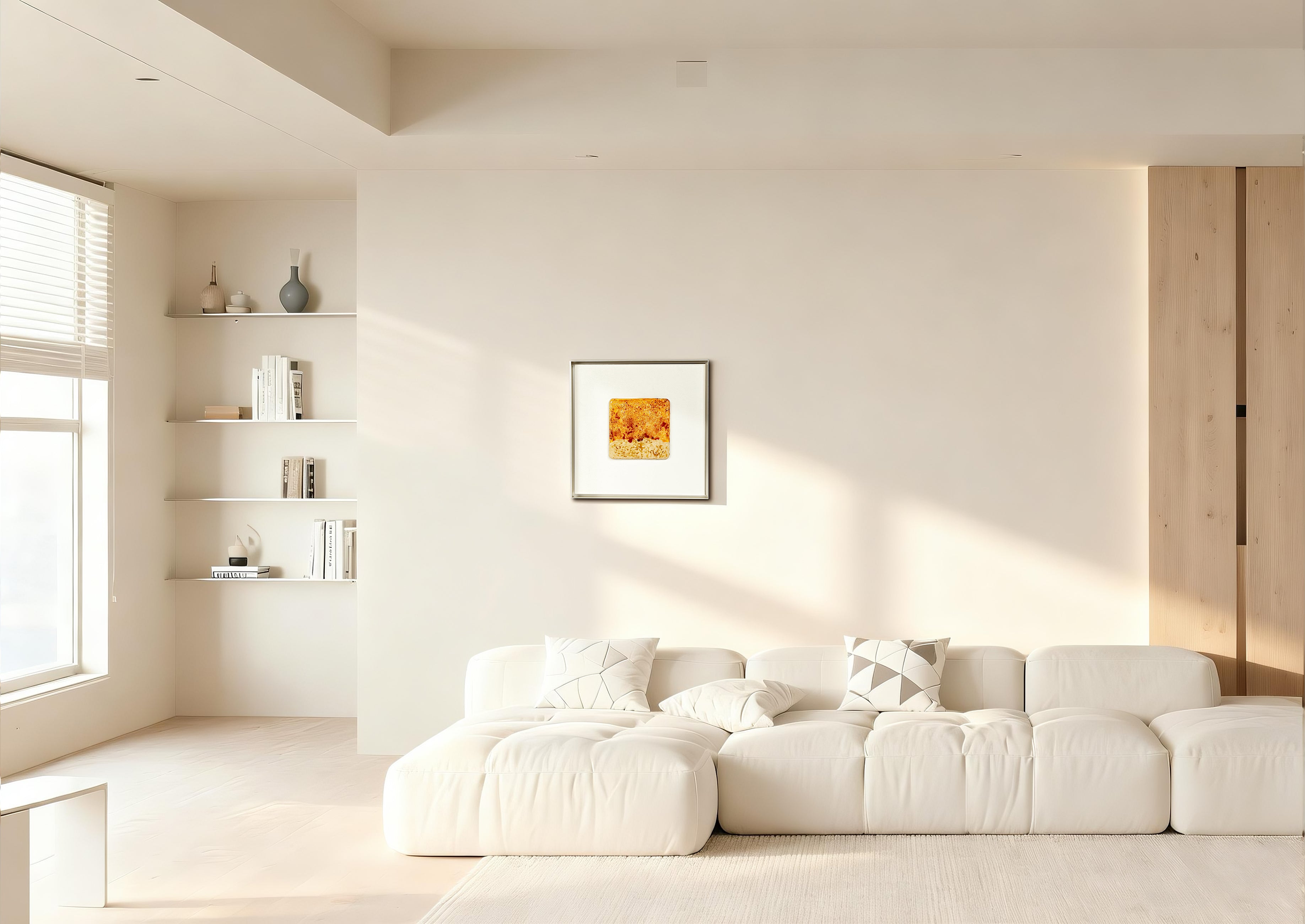 Igneous — Mineral Texture · Aura Frame displayed in an interior setting, its fire element energy and richly crackled mineral texture — warm ochre and amber tones bleeding naturally across the surface — bringing the raw heat of ancient volcanic terrain to the wall.