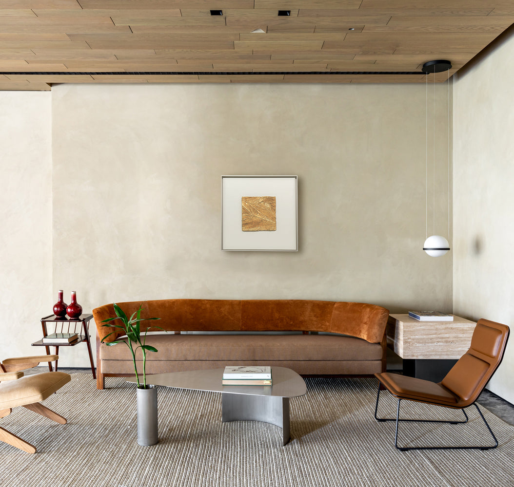 Meridian — Gilded Foil · Aura Frame displayed in an interior setting, its metal element energy and topographic 3D mineral texture — branching gold vein channels refracting light across the surface — bringing the latent richness of unearthed ore to the wall.