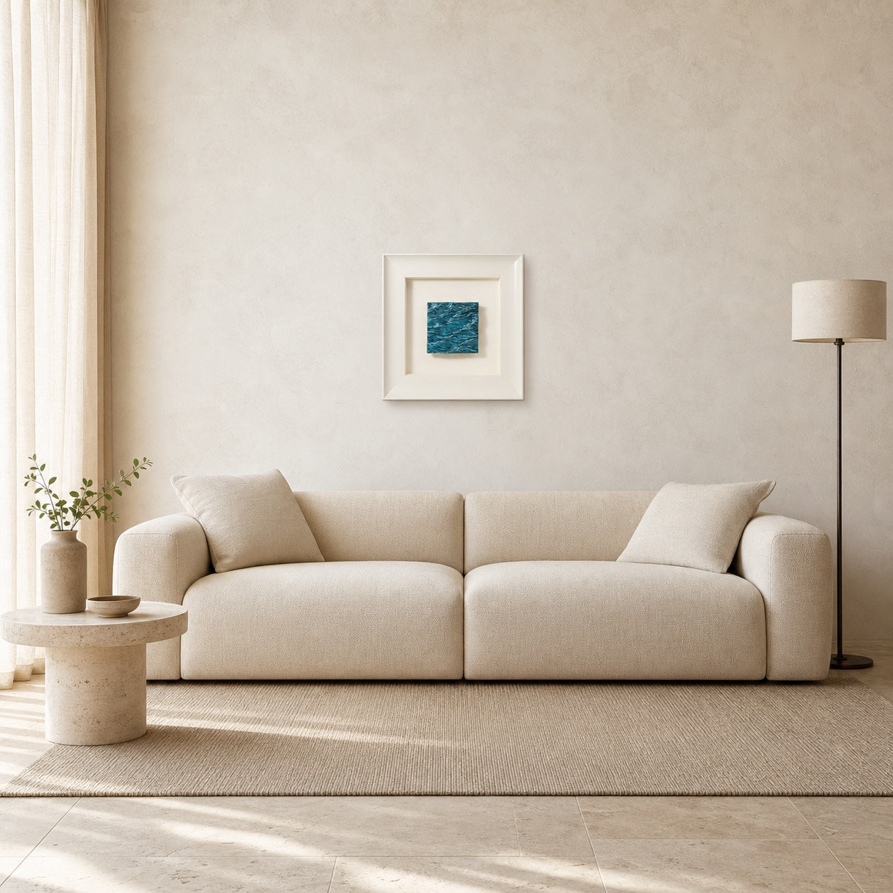 Pelagic Aura Frame shown at its 45 by 45 cm scale above a 210 cm cream sofa
